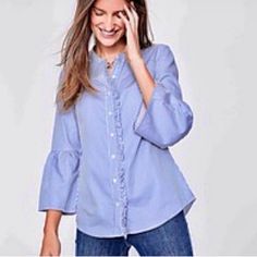 Nwt Boden Bell Sleeve Button Down Ruffle Shirt. This Is More Than Just An Everyday Shirt. This One Has Extra Feminine Flair With Elegant Fluted Sleeves And Ruffle Detailing Down The Front Placket. Button Down. Round Neck. No Collar. 3/4 Length Sleeves With Wide Bell Cuff. Rounded Hem. Crafted From Soft Cotton Sateen. Chambray Style. Solid. Blue With Purple Undertones. Crisp, Clean Cut, Preppy, Boho, Collar-Less, Bishop Collar, Bracelet Sleeves, Office, Work, Business Casual, Professional, Career Blue Blouse With Button Cuffs For Spring, Blue Tops With Button Cuffs For Day Out, Bishop Collar, Fluted Sleeves, Floral Peasant Top, Sheer Long Sleeve Top, Preppy Boho, Peasant Shirt, Teal Blouse