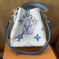 Brand New With Tags Never Been Worn 2023 Louis Vuitton Neonoe Bb By The Pool Bag. Such A Cute Summer Bag! I Ordered It For A Trip To Europe But It Did Not Arrive In Time And I Ended Up Purchasing A Different Bag While Away. Blue And White Canvas With Large Monogram Letters. Comes With Original Shopping Box, Box, Dust Bag, And Can Include My Receipt! 7.9 H X 7.9 W X 5.1 D Louis Vuitton Beach Bag, Pool 2023, Lv Colorful Bag, Painted Purses, Louis Vuitton Bumbag, Monet Louis Vuitton Bag, Louis Vuitton Neverfull Damier, Louis Vuitton Felicie, Louis Vuitton Petit Noe