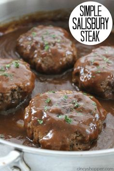 some meatballs are being cooked in a pot on the stove with a label that says simple salisbury steak