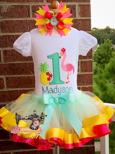 Personalized Embroidery Flamingo and Pineapple Birthday Ribbon Trimmed Tutu Set, Summer, Beach, Any Birthday, Birthday outfit, tutu dress 0-18 Months will be a bodysuit and 2T up will be a shirt If you order a tutu and Shirt I include a hairbow for Free. The Hairbow will match the outfit but it will not always be just like the one pictured. I can make this set with for any age. I can change colors upon request. I only use boutique quality shirts which are super soft and true to size. All my prod Fun White Tutu Dress For Birthday, Yellow Tutu Dress For Birthday, Green Spring Birthday Tutu Dress, Spring Birthday Tutu Dress With Short Sleeves, Green Spring Tutu Dress For Birthday, Yellow Tutu Dress For Birthday In Summer, Spring Green Tutu Dress For Birthday, Short Sleeve Tutu Dress For Spring Birthday, Spring Short Sleeve Tutu Dress For Birthday