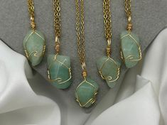 Save when you shop through my website, I'd appreciate it 💚- https://shorturl.at/dGU49 🤍 Lovingly Handmade Crystal Necklaces 🤍 *PLEASE NOTE:  The picture displayed is for reference. Please be advised your chosen crystals will differ in size and colour as each  is natural and unique* ✨check out the rest of my crystal jewellery here - https://etsy.me/3nxyN99 ✨ ✨ Chain Choice ✨ (Tarnish resistant, stainless steel chains) 1. Cord (2mm) 18-20"  2. Cable (2mm) 14",16", 18" or 20" 3. Cable (1.5mm) 14 Green Aventurine Necklace, Handmade Crystal Necklace, Aventurine Necklace, Gemstone Jewelry Handmade, Wrapped Pendant, Organza Gift Bags, Green Crystals, Green Aventurine, Wire Wrapped Pendant