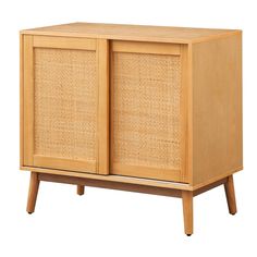 a wooden cabinet with two doors and wicker panels on the front, against a white background