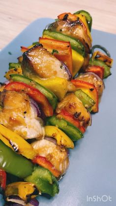 grilled vegetables arranged on a blue plate