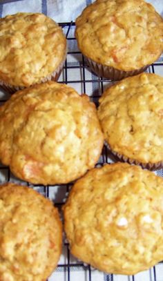 several muffins sitting on top of a cooling rack