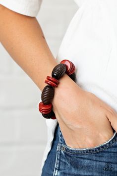 A summery collection of oversized brown wooden beads and distressed red wooden discs are delicately threaded along stretchy bands around the wrist for a beach inspired fashion.

 Sold as one individual bracelet. Bracelets Trendy, Brown Bracelet, Wooden Bracelet, Wood Bracelet, Red Bracelets, Wood Necklace, Red Shop, Jewelry Images, Paparazzi Accessories