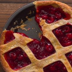 two pieces of pie with cherries on top