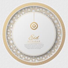 an elegant gold and white plate with the inscription eid mubarak on it