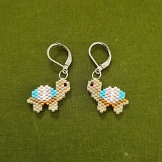 the earrings are made out of small beads