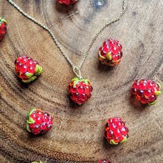 Growing up, my mom planted raspberry bushes around the perimeter of our house. She'd make jam every summer and give it as gifts for Christmas. I'd help her sometimes ❤️ there is something grounding about picking berries in your own backyard 🍓 This is a handblown glass raspberry necklace.  The berry is anatomically correct in size and detail.  The berries are bright red and each bead is 12-15 mm in length. Pictured is a gold chain, but I have many different metals and lengths to choose from ✨ Th Raspberry Jewelry, Raspberry Bushes, Picking Berries, Make Jam, Pomegranate Necklace, Fruit Necklace, Beads Craft Jewelry, Raspberry Fruit, Fruit Jewelry