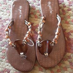 These Cute Sandals Are Made By Just Be Brown And Tan Size 6 New Without Tags Brown Open Toe Flip Flops For Beach Season, Brown Synthetic Flip Flops For Vacation, Brown Flat Sandals For The Beach, Brown Flat Sandals For Beach Season, Brown Synthetic Flip Flops For Summer, Brown Flat Sandals For Beach, Brown Toe Post Sandals For The Beach, Flat Brown Sandals For The Beach, Flat Brown Sandals For Beach