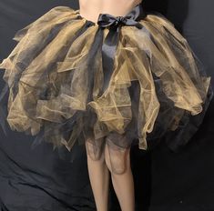 This super elegant beautifully made  extra full  and super puffy adult Tutu is great for many occasions. Bold  deep  Rich Colors  to enhances the Artistry of this Tutu! Handmade from 100% Polyester. Comes with 1 inch Elastic Waistband and Comes with a beautiful Black Bow. Lightweight and well Crafted. Can be Used as Casual or Formal Wear. This length  is available in other colors as well, please leave me a note with your color choices  in the message  box provided. and I will be glad  to create Black Petticoat For Halloween Party, Gold Ruffled Tutu Dress For Wedding, Black Halloween Party Petticoat, Black Luxury Tutu Dress, Bumble Bee Tulle Skirt, Black Tulle Tutu Dress For Dress-up, Plus Size Tutu, New Years Celebration, Gold Tulle