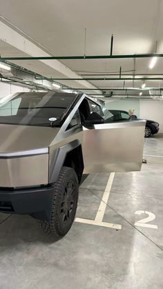 a silver car parked in a parking garage