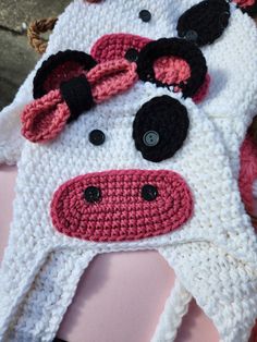 a crocheted hat with a cow's head on it