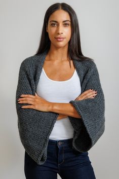 The Simple Shrug is for absolute beginners and is designed by Roni Halloran. It is knit with a super bulky yarn for a cozy shrug. The Design integrated with our skills videos to teach you knitting basics, and our Kit has everything you need to make our stylish Simple Shrug. All you need to do is choose a color that you love. The shrug's finished dimensions will be: 29 1/4 (29 1/4, 31 1/2, 33 3/4)" tall, 53 (57,61, 65)” wide from wrist to wrist. The kit price ranges from $135 to $185, depending u House Tutorial, Knitting Basics, Cedar Homes, Stitch Fit, Knit Shrug, Super Bulky Yarn, Row House, Super Bulky, Online Pattern