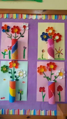 four flower vases made out of paper on a purple background with colorful strips of colored paper