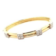 Vintage Tiffany & Co. 18k Yellow Gold Diamond Bangle Bracelet  Metal: Tiffany Box + Pouch Included   Metal: 18k Yellow Gold Measurements:  Length: 6.5"  Width: 7mm Weight: 24.6 grams Stones: 16 brilliant round cut diamond VS1 clarity, E color total weight approximately 1.12ct Hallmarks: Tiffany 18k  Please reference the dimensions in the description for the best approximate dimensions. Tiffany Box, Diamond Bangle Bracelet, Box Pouch, Vintage Tiffany, Bracelet Metal, Diamond Bangles Bracelet, Tiffany And Co, Diamond Bangle, Metal Bracelets