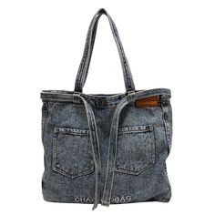 a handbag made out of jeans with the word chaos printed on it's front pocket