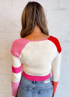 Make a bold style statement with our colorblock stripe sweater, a chic and contemporary piece that effortlessly combines vibrant hues and sleek design for a trendy look. 55% Rayon 45% Nylon Hand Wash Cold Line Dry Model in Red: Meet Brae! Height: 5’7” Hips: 35” Bust:34” Waist: 25” Wearing Size: Small Model in Blue: Meet Katy! Hips: 35" Waist: 26" Bust: 32" Height: 5' 9" Wearing Size: Small Sporty Color Block Sweater For Spring, Trendy Crew Neck Sweater With Contrast Stripes, Striped Color Block Tops For Winter, Spring Crew Neck Sweater With Contrast Color, Trendy White Color Block Sweater, Winter Multicolor Striped Sweater, Retro Striped Color Block Sweater, Multicolor Long Sleeve Sweater With Contrast Stripes, Winter Red Tops With Contrast Stripes