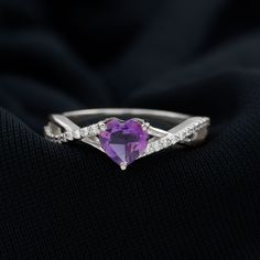 Product Details The Crisscross Ring is elegantly adorned with Heart Shape Amethyst secured in 3 Prong Setting to make it a magnificent choice. Additionally Round Diamonds studded on the unique shank. • Whether its a day plan or a night out with your girls, our Amethyst Solitaire Ring will never disappoint you. Product Information SKU SHP-RINGS072210104 Weight 2.56 gm (Approximate) AMETHYST INFORMATION No.of Stones 1 Pieces Total Weight 0.90 Carat (Approximate) Dimension(approx) Heart-6X6 mm-1 Pc Valentine's Day Purple Amethyst Promise Ring, Amethyst Heart Cut Promise Ring, Amethyst Heart Ring For Valentine's Day, Purple Heart Ring For Promise, Fine Jewelry, Fine Jewelry Purple Amethyst Ring For Valentine's Day, Heart Shaped Amethyst Promise Ring, Purple Rings With Accent Stones For Valentine's Day, Purple Heart-shaped Rings For Anniversary, Valentine's Day Purple Rings With Accent Stones