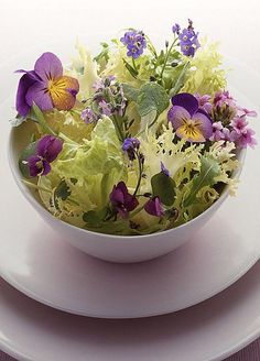 a magazine cover with flowers in a bowl