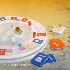 the board game islandpoly is set up on a table with other items around it