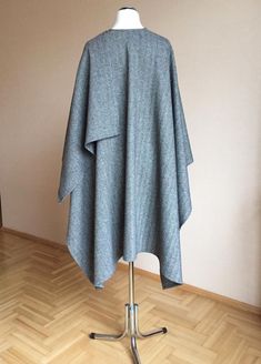 "80% Virgin wool 20% PL Size : Large Oversized Length - shoulder to hem : 100cm/ 39.4\" Width - Across back from armhole to armhole : 145cm / 57\" Care: Dry cleaning Ready to ship I ship internationally registered airmail with tracking number from Lithuania All Ruanas / wraps here https://www.etsy.com/shop/JPalKnits?ref=seller-platform-mcnav&section_id=26910076 I make all my designs in a pet-free and smoke-free environment Thank you for visiting my shop https://www.etsy.com/shop/JPalKnits Wi Oversized Gray Cape For Fall, Oversized Wool Poncho With Long Sleeves, Oversized Gray Poncho For Fall, Gray Oversized Poncho For Winter, Oversized Gray Poncho For Winter, Oversized Wool Shawl Outerwear, Ladies Poncho, Wool Poncho, Wool Shawl