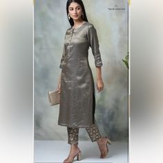 Metallic Cotton Straight Kurta Pants Set Brown Kurta Pants Set From Biba Festive Collection. The Set Includes A Straight Cut Kurta And Brocade Pants. This Set Comes With Viscose Lining. Elegant Straight Kurta Pant Set For Party, Elegant Festive Trouser Sets, Elegant Fitted Silver Pants, Elegant Festive Trousers Set, Elegant Silver Party Kurta, Elegant Silver Formal Pants, Elegant Silver Kurta For Formal Occasions, Elegant Metallic Pants For Work, Elegant Silver Fitted Pants