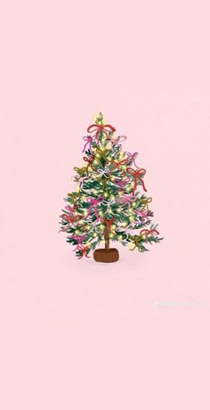 a small christmas tree with ribbons and bows on it's top, against a pink background