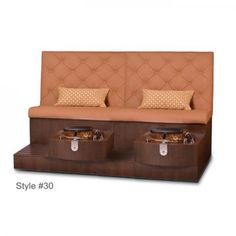 two suitcases are sitting next to each other in front of a couch with pillows on it