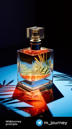 a bottle of perfume sitting on top of a blue and red tablecloth with palm leaves in it