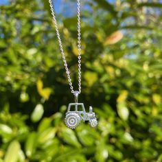 With our country surroundings, we couldn't not have a Sterling Silver Tractor Necklace in our collection could we?! Crafted from high quality sterling silver with a wonderful high shine finish, this necklace is just fab. The tractor sits flat against the chest in a two-dimensional design, and its high shine reflective finish and exquisite detailing make it so loveable. The tractor sits on a sterling silver chain which is adjustable from 16 to 18 inches. Adding a touch of fun to any outfit, the n Classic Tractor, Country Jewelry, Sterling Silver Chain, Necklace Silver, Sterling Silver Chains, Pretty Things, Tractor, Silver Necklaces, Pendant Necklaces