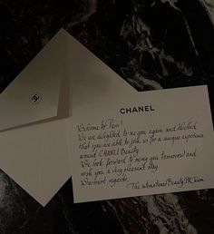 an envelope with a note attached to it