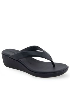 The Aerosoles Isha sandal is an exquisite piece of footwear, crafted with a sleek thong upper and a cushioned footbed inset atop a molded, lightweight unit wedge. Its refined silhouette and superior durability make this sandal perfect for special occasions and everyday wear alike. Experience the luxury of Isha today.FAUX LEATHER UpperSynthetic LiningTPR OutsoleDIAMOND FLEX OUTSOLE Footbed2" Heel heightSandal available in sizes 5-10M with half size,11M,12M | Women's Isha Sandal by Aerosoles in Bl Adjustable T-strap Synthetic Sandals With Cushioned Footbed, Leather Sandals With Gel Cushioning For Beach, Leather Beach Sandals With Gel Cushioning, Beach T-strap Sandals With Toe Loop And Arch Support, Synthetic T-strap Sandals With Single Toe Strap, Synthetic T-strap Sandals With Heel Loop, Synthetic Toe Post Sandals With Cushioned Footbed, Modern Synthetic Toe Post Flip Flops, Synthetic Toe Post Wedge Sandals