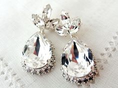 Clear white Chandelier earrings Bridal by EldorTinaJewelry on Etsy, $78.00 #bridal earrings #wedding jewelry #bridesmiads gift #accessories #fashion jewelry #women's fashion Elegant Bling Crystal Earrings For Wedding, Elegant Wedding Crystal Earrings With Bling, Wedding Drop Crystal Earrings With Rhinestones, Elegant Crystal Jeweled Earrings For Wedding, Elegant Wedding Crystal Earrings, Silver Crystal Bridal Earrings For Bridesmaid, Elegant Jeweled Wedding Earrings, Bridal Earrings Chandelier, Drop Earrings Silver