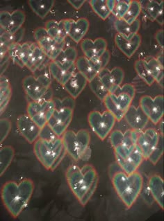 many heart shaped lights are shown in the shape of hearts with different colors and shapes