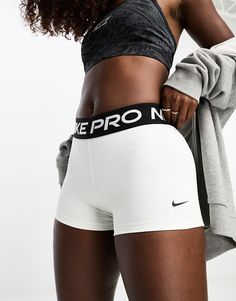 Shorts by Nike Training Take the short cut Branded design High rise Elasticized waistband bodycon fit White Nike Pros Outfit, Nike Pro Shorts Outfit Summer, Nike Pro Shorts Outfit, Short Nike Pro, Womens Workout Shorts, Nike Pro Collection, Track Fits, White Nike Pros, White Running Shorts