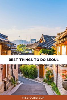 an alley way with the words best things to do seoul in front of buildings and trees