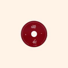 a red disc with the word act on it's front and back side, against a white background