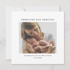 a woman holding a baby in her arms with the words emmeline has arrived