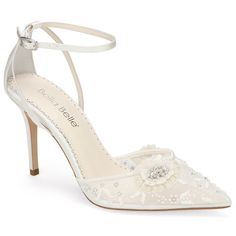 a women's white high heeled shoe with flowers