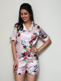 Our Blossom PJ Set is made from silky soft soft satin and is the perfect loungewear. It looks classy and feels amazing on the skin. This listing is for the short sleeves with shorts. We can make the PJ in the following four styles. - Short Length Sleeves + Shorts - Short Sleeves + Pants - Long Sleeves + Shorts - Long Sleeves + Pants Link for other styles: https://www.etsy.com/in-en/listing/735248161/bridesmaid-pjs-bridesmaid-pj-set?ref=shop_home_active_4&pro=1 EMBROIDERY: We offer various op Pink Floral Print Home Set, Pink Home Sets With Floral Print, Short Sleeve Floral Print Sets For Sleepovers, Floral Print Short Sleeve Sets For Sleepover, Feminine Floral Print Wedding Sets, Feminine Floral Print Pajama Party Sets, Floral Print Sleep Sets With Short Sleeve, Short Sleeve Floral Sleep Set, Short Sleeve Floral Print Sleep Sets