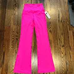 Woman’s Hot Pink Bellbottom Leggings - Brand New With Tags Never Worn! High-cut Leg Pink Bottoms For Spring, Pink High-cut Leg Bottoms For Spring, Full Length Gym Bottoms For Summer, Pink High-cut Leg Stretch Bottoms, Pink High-cut Leg Sports Bottoms, Pink Stretch Mid-rise Bottoms, Pink Fitted Yoga Pants With Elastic Waistband, Fitted Pink Yoga Pants With Elastic Waistband, Summer Workout Bottoms Full Length