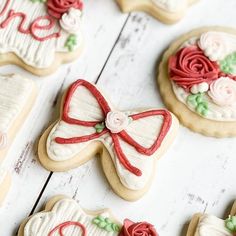 decorated cookies are arranged on a white table