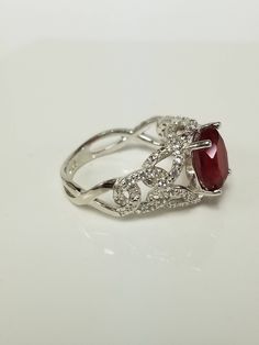 "Thanks for shopping our vintage estate store. We tend to sell well below wholesale and truly hope you enjoy all of our items. Many of the items are one of a kind, so please enjoy scrolling through the pictures and hopefully something will catch your eye. Black spots are from reflections. Nice estate sterling silver 925 red ruby cz diamonds ring. This is a custom made ring from our shop, meaning we added the gem to the setting. Ring size: please select a size Setting: 5/8\" 12mm Band width: 2mm Gifts For Work Colleagues, Clean Rings, Dog Earrings, Diamond Cocktail Rings, Black Spot, Cz Diamond, Unusual Gifts, Cocktail Rings, Diamond Rings