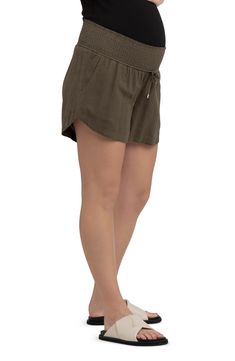 A wide smocked waistband adds stretchy comfort to these versatile, casual-chic maternity shorts. 4" inseam 60% viscose, 40% linen Hand wash, dry flat Imported Versatile Vacation Shorts With Elastic Waistband, Casual Beach Bottoms With Gathered Waist, Versatile Shorts With Elastic Waistband For Vacation, Casual Shorts With Gathered Waist For Vacation, Casual Shorts With Gathered Waist, Vacation Bottoms With Gathered Waist And Short Length, Versatile Vacation Shorts, Beach Bottoms With Gathered Waist And Short Length, Short Beach Bottoms With Gathered Waist