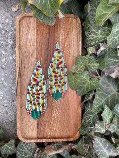 Poppy flower beaded earrings, powder green floral Fringe Seed bead earring Summer Bright flowers earring Beadwork dangle earring Long Boho ♥𝑇ℎ𝑒 𝑝𝑎𝑡𝑡𝑒𝑟𝑛 𝑜𝑓 𝑡ℎ𝑖𝑠 𝑒𝑎𝑟𝑟𝑖𝑛𝑔 𝑖𝑠 𝑐𝑟𝑒𝑎𝑡𝑒𝑑 𝑏𝑦 𝐾𝑎𝑍𝑒𝐵𝑒𝑎𝑑𝐽𝑒𝑤𝑒𝑙𝑟𝑦 ♥𝑀𝑎𝑑𝑒 𝑢𝑠𝑖𝑛𝑔 𝑓𝑟𝑒𝑒ℎ𝑎𝑛𝑑 𝑏𝑒𝑎𝑑𝑖𝑛𝑔 𝑤𝑜𝑣𝑒𝑛 𝑡𝑒𝑐ℎ𝑛𝑖𝑞𝑢𝑒𝑠 𝑤𝑖𝑡ℎ 𝑠𝑡𝑟𝑜𝑛𝑔 𝑠𝑦𝑛𝑡ℎ𝑒𝑡𝑖𝑐 𝑡ℎ𝑟𝑒𝑎𝑑. ♥𝑇ℎ𝑒 𝑠𝑖𝑧𝑒 𝑜𝑓 𝑡ℎ𝑒 𝑠𝑒𝑒𝑑 𝑏𝑒𝑎𝑑𝑠 𝑢𝑠𝑒𝑑 𝑖𝑠 2 𝑚𝑖𝑙𝑙𝑖𝑚𝑒𝑡𝑒𝑟𝑠 𝑎𝑛𝑑 𝑏𝑒𝑎𝑑𝑠 𝑎𝑟𝑒 ℎ𝑖𝑔ℎ 𝑞𝑢𝑎𝑙𝑖𝑓𝑖𝑒𝑑. ♥𝐴𝑙𝑙 𝑡ℎ𝑒 ℎ𝑜𝑜𝑘𝑠 𝑢𝑠𝑒𝑑 𝑖𝑛 𝑜𝑢𝑟 𝑗𝑒𝑤𝑒𝑙𝑟𝑦 𝑎𝑟𝑒 24 𝑘 𝑔𝑜𝑙𝑑 𝑝𝑙𝑎𝑡𝑒𝑑 𝑎𝑛𝑑 ℎ𝑦𝑝𝑜𝑎𝑙𝑙𝑒𝑟𝑔𝑒𝑛𝑖𝑐. ♥𝑇ℎ𝑒𝑠𝑒 𝑎𝑟𝑒 𝑣𝑒𝑟𝑦 𝑙𝑖𝑔ℎ𝑡 𝑒𝑎𝑟𝑟𝑖𝑛𝑔𝑠 𝑡ℎ𝑎𝑡 𝑦𝑜𝑢 𝑐𝑎𝑛 𝑤𝑒𝑎𝑟 𝑎𝑙𝑙 𝑑𝑎𝑦 𝑤𝑖𝑡ℎ𝑜𝑢𝑡 ℎ𝑢𝑟𝑡𝑖𝑛𝑔 𝑦𝑜𝑢𝑟 𝑒𝑎𝑟! The onl Green Teardrop Earrings With Tiny Beads, Green Teardrop Beaded Earrings With Tiny Beads, Unique Green Beaded Dangling Earrings, Unique Green Teardrop Beaded Earrings, Handmade Green Dangle Flower Earrings, Handmade Green Flower Drop Earrings, Unique Green Dangle Flower Earrings, Green Flower Drop Earrings With Dangling Beads, Green Flower-shaped Jewelry With Dangling Beads