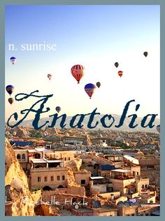 there are many hot air balloons flying in the sky above some buildings and hills with words that read anatolia