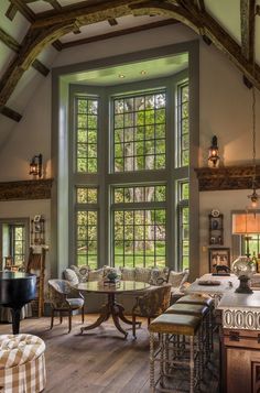 a living room filled with furniture and windows