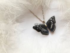 Midnight Black Pendant with Silk Butterfly Wings! :)Do you remember the first time when a butterfly sat on you? :) If not you must feel it in your free time in some butterfly garden! :) It inspired me when I was making this butterfly It will add to your look a touch of nature, the butterfly will flutter on you as it's a real one :)The butterfly is made manually of natural silk. Using multiple levels gives an unusual flickering 3D effect.Due to properties of natural silk wings are light and trans Black Butterfly Charm Jewelry, Black Butterfly-shaped Jewelry For Gift, Black Butterfly Jewelry For Gift, Elegant Black Butterfly Charm Necklace, Elegant Black Necklace With Butterfly Charm, Handmade Black Butterfly Jewelry, Black Butterfly Necklace For Gift, Elegant Black Butterfly Necklace Gift, Handmade Black Butterfly Necklace