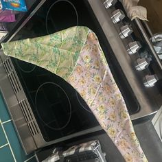 an upside down umbrella is sitting on the stove